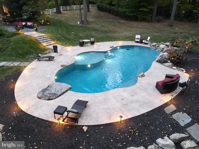 view of swimming pool with a patio and a lawn