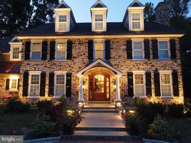 colonial inspired home with a porch