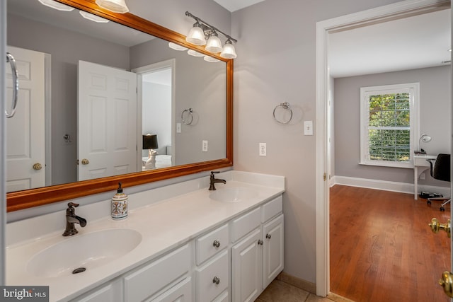 bathroom with vanity and wood-type flooring