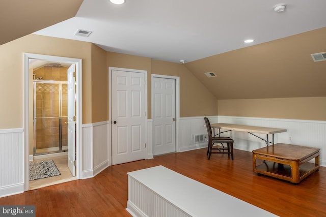 office space with lofted ceiling and hardwood / wood-style floors