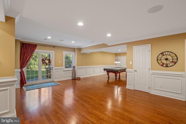 rec room with crown molding, light wood-type flooring, and billiards