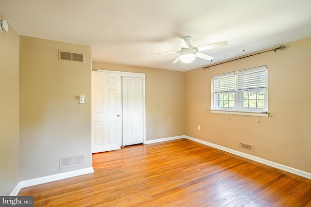 unfurnished room featuring ceiling fan and light hardwood / wood-style floors