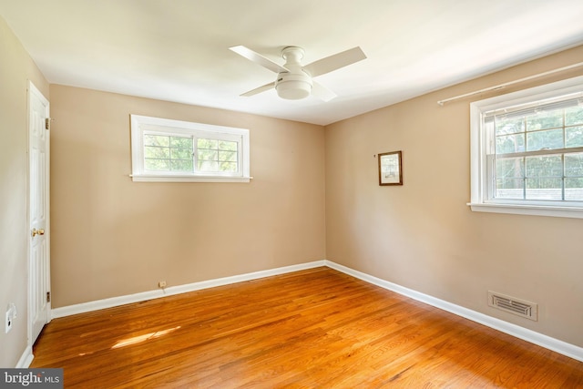 unfurnished room featuring ceiling fan and light wood-type flooring