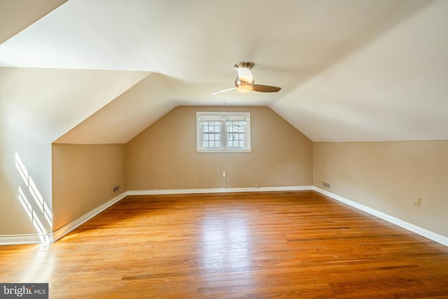 additional living space with lofted ceiling, ceiling fan, and light hardwood / wood-style flooring