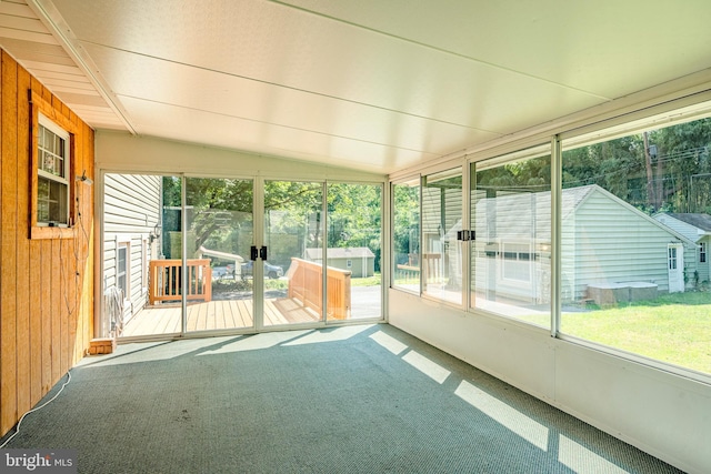 unfurnished sunroom with vaulted ceiling