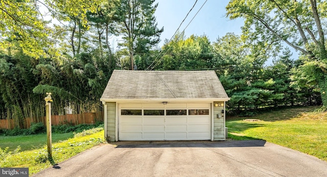 garage featuring a yard