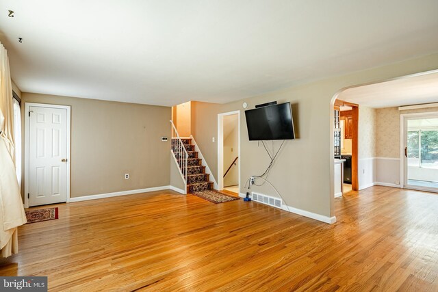 unfurnished living room with light hardwood / wood-style flooring