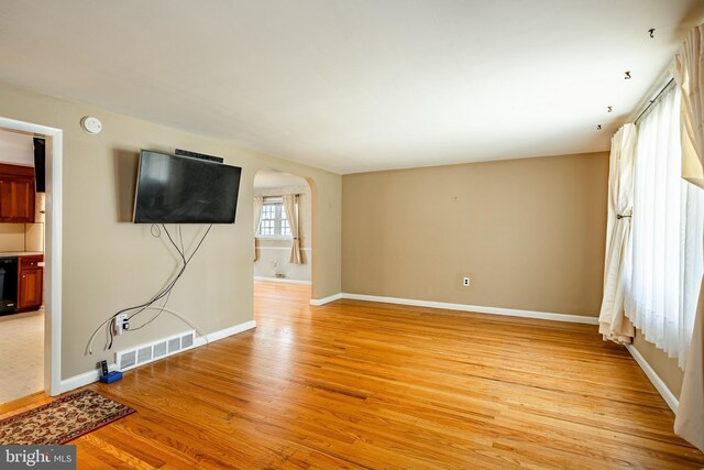 unfurnished living room with light wood-type flooring