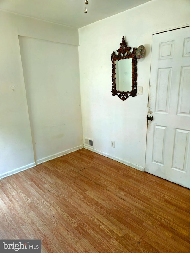 spare room with light hardwood / wood-style flooring