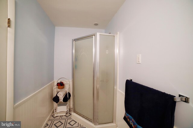 bathroom featuring an enclosed shower