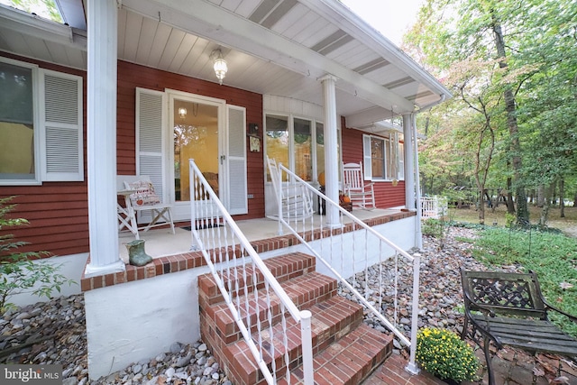 property entrance with covered porch