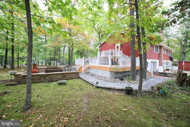 view of yard featuring a wooden deck