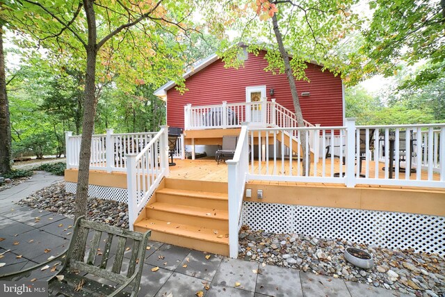 back of property with a deck