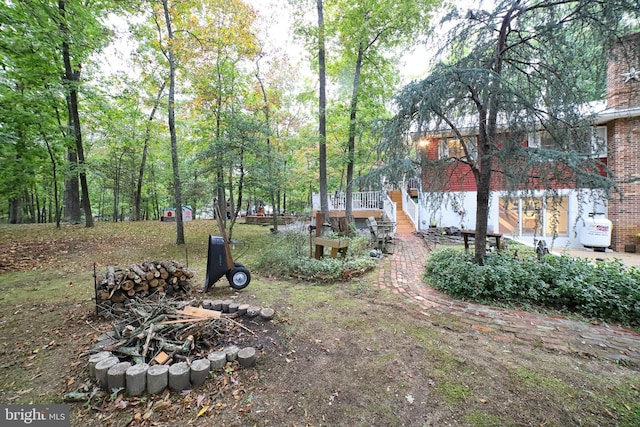 view of yard featuring a wooden deck