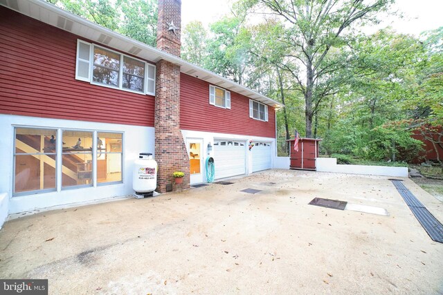 view of property exterior featuring a garage