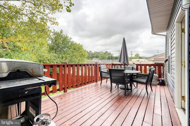 wooden terrace with area for grilling