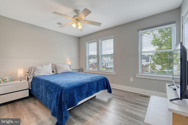 bedroom featuring hardwood / wood-style floors and ceiling fan