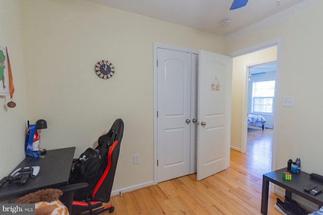 office with ceiling fan and light wood-type flooring