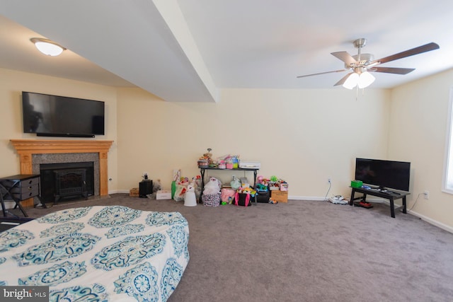 bedroom featuring ceiling fan and carpet