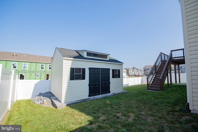 view of outdoor structure featuring a lawn