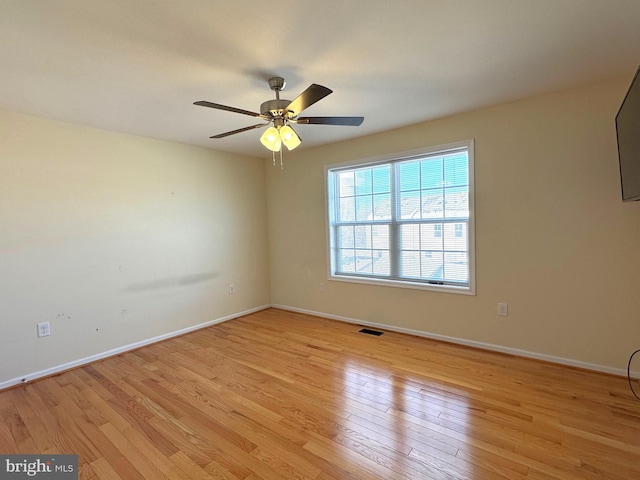 unfurnished room with ceiling fan and light hardwood / wood-style floors