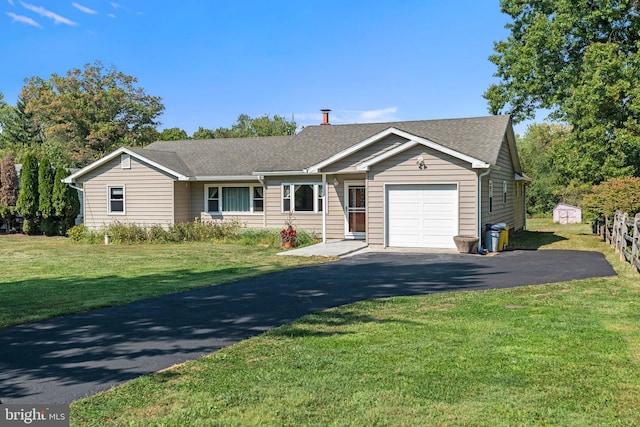 single story home with a garage and a front lawn