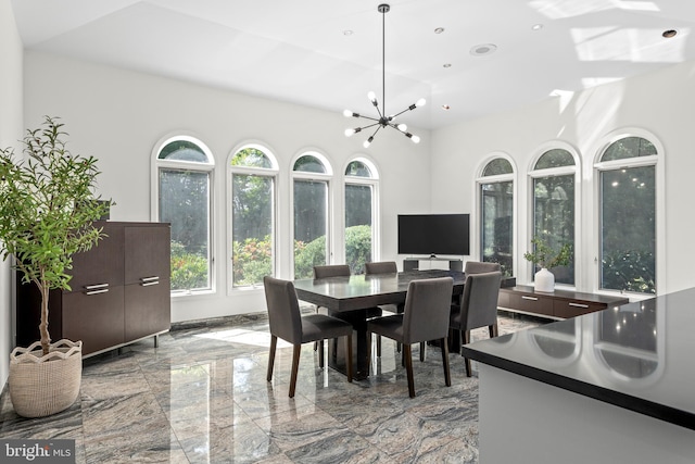 dining space featuring a notable chandelier