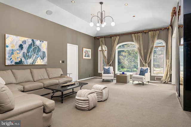 living room with a chandelier, carpet floors, and vaulted ceiling