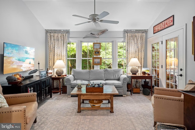 living room featuring ceiling fan, lofted ceiling, and french doors