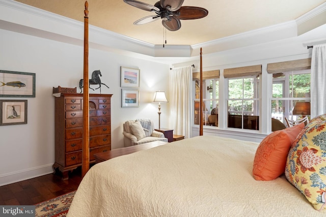 bedroom with ornamental molding, ceiling fan, and dark hardwood / wood-style flooring