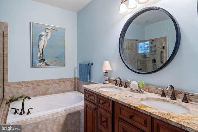 bathroom with vanity and separate shower and tub