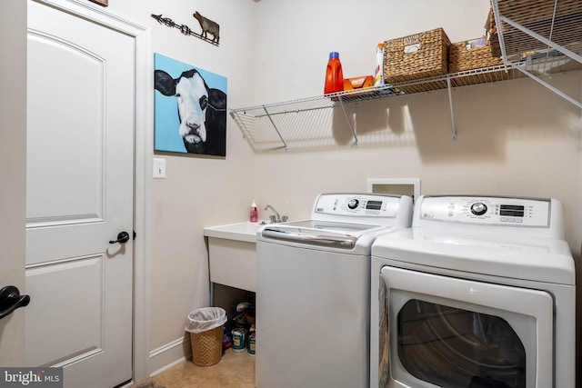 laundry area with independent washer and dryer