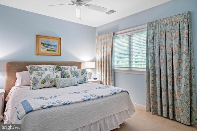 bedroom with light carpet and ceiling fan