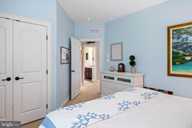 carpeted bedroom with a closet