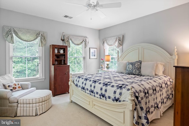 carpeted bedroom with ceiling fan