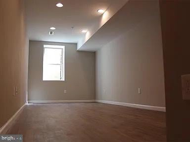unfurnished room with recessed lighting and baseboards