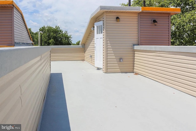 view of patio featuring a balcony
