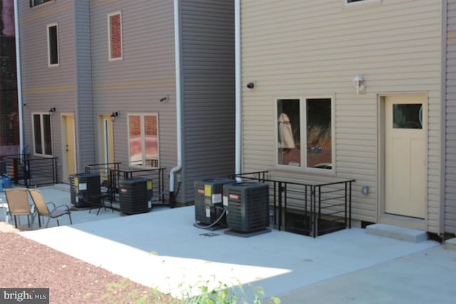 back of house featuring a patio area and cooling unit