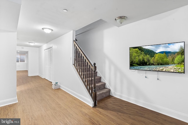 stairway featuring hardwood / wood-style flooring