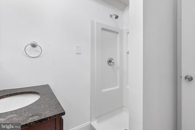 bathroom featuring vanity and walk in shower