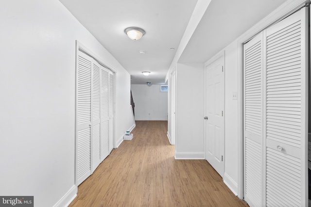 hallway with light wood-type flooring