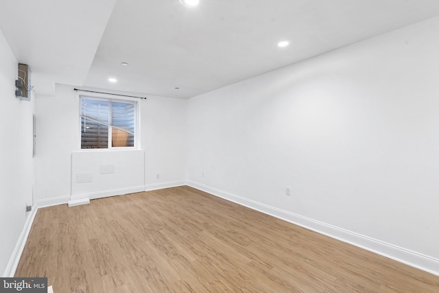 spare room with light wood-type flooring