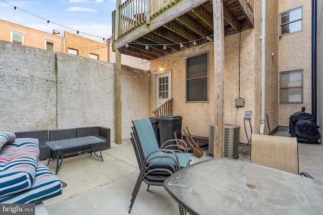 view of patio with an outdoor hangout area and central AC unit