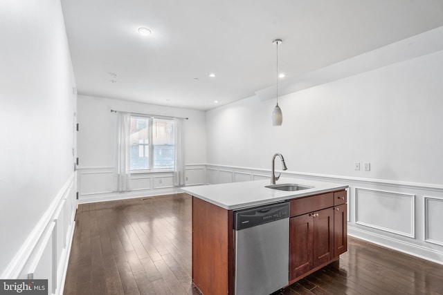 kitchen featuring a center island with sink, hanging light fixtures, dishwasher, dark hardwood / wood-style floors, and sink