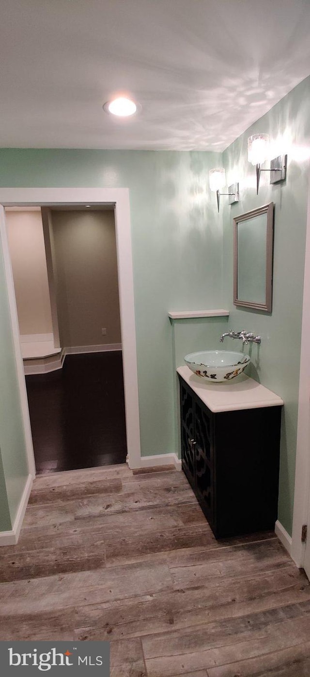 bathroom featuring vanity and hardwood / wood-style floors