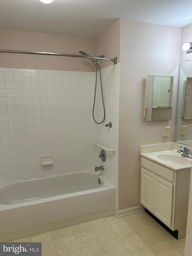 bathroom with vanity, tile patterned floors, and tiled shower / bath