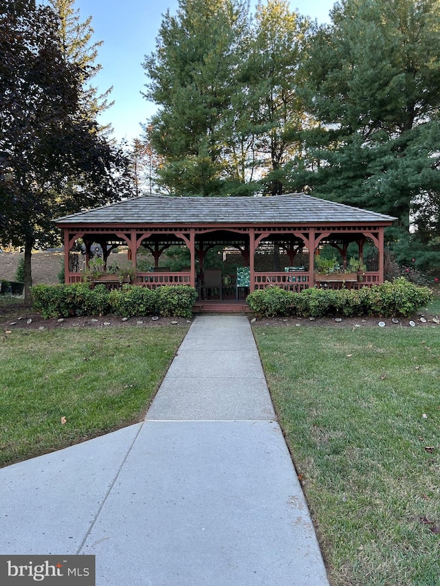 view of home's community with a gazebo and a lawn