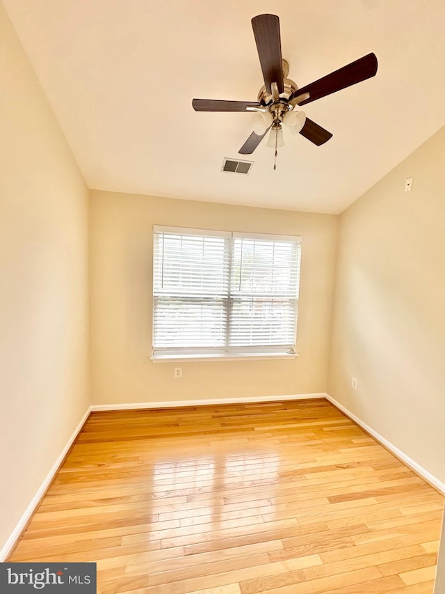 empty room with light hardwood / wood-style floors and ceiling fan