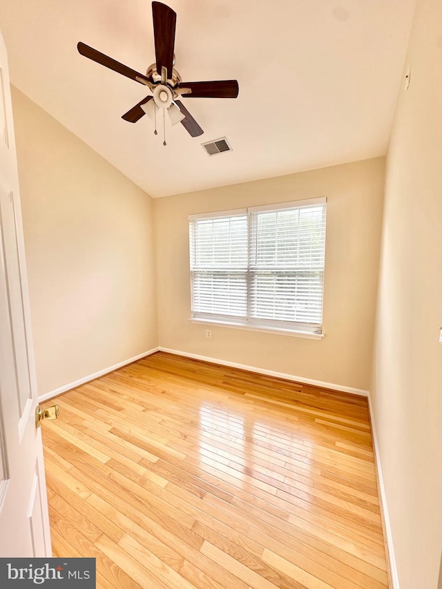 empty room featuring light hardwood / wood-style flooring and ceiling fan