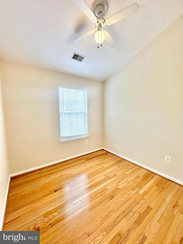 spare room featuring ceiling fan and light wood-type flooring